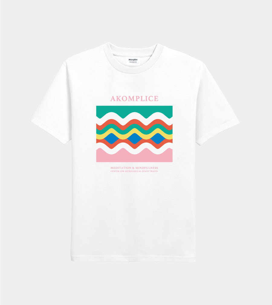 White t-shirt with colorful wavy design and 'AKOMPLICE' branding on a white background
