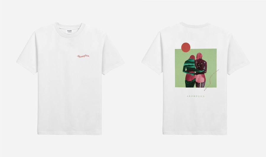 White t-shirt with a graphic design of two people holding hands on a green background.
