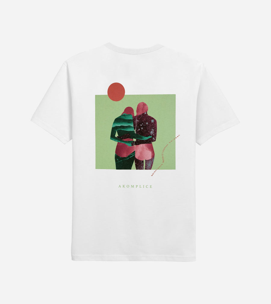 White t-shirt with a graphic design of two people embracing on a green background, brand 'Krompech' visible.